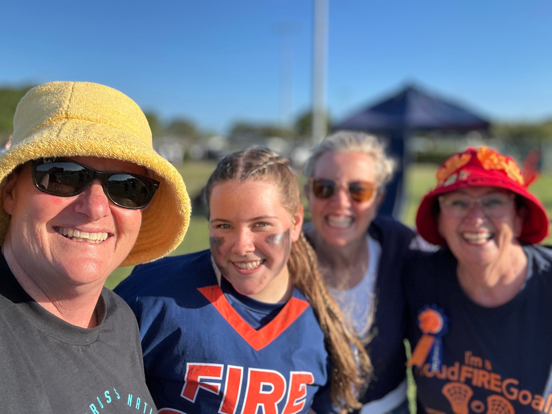 Ivy smiling with FIRE supporters at the tournament.
