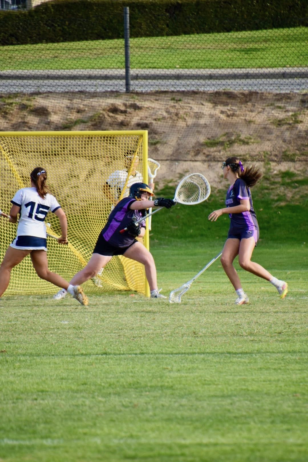 Ivy Merritt making a save in goal in 2026.