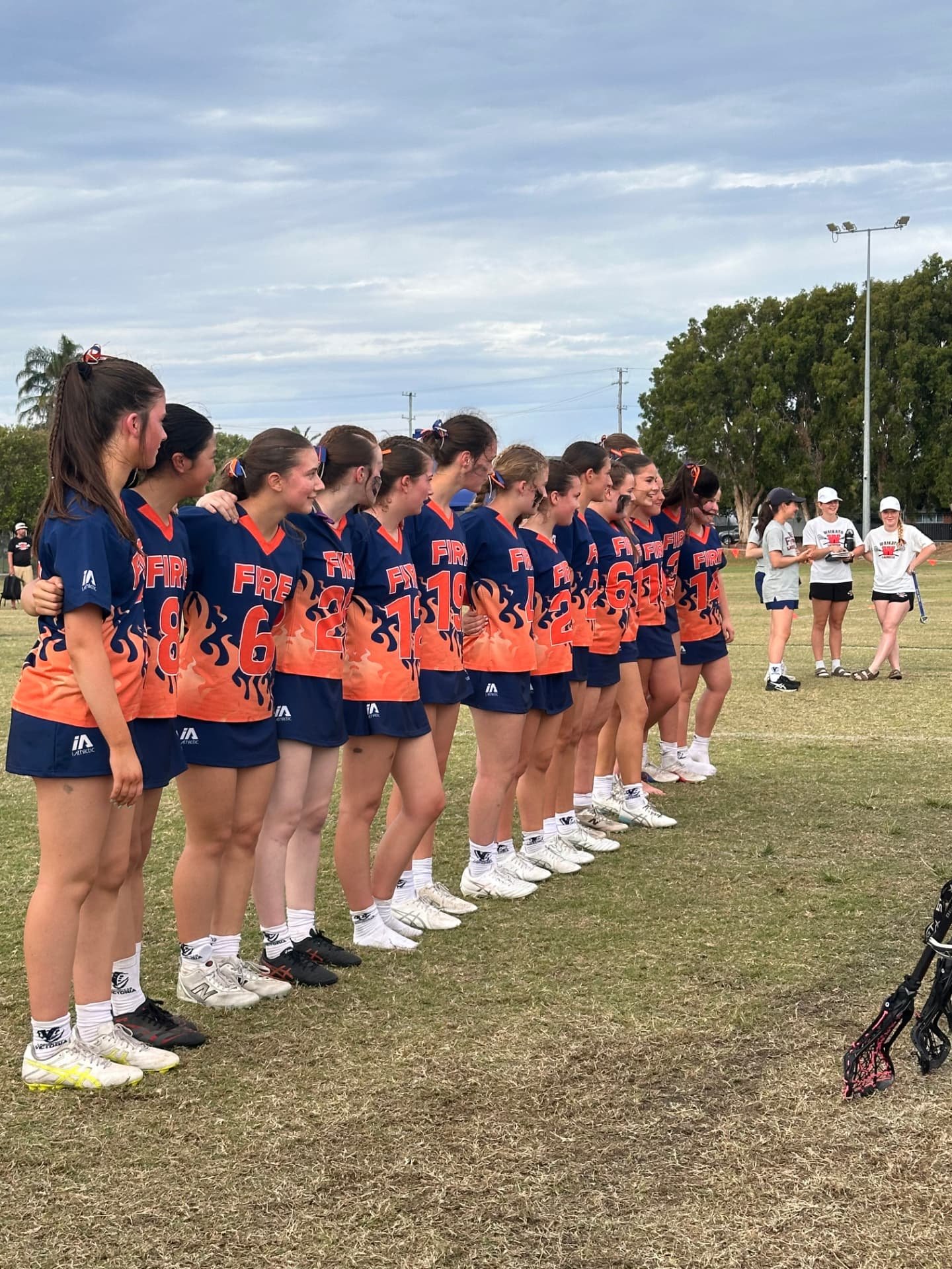 FIRE players lined up on the field before a match.
