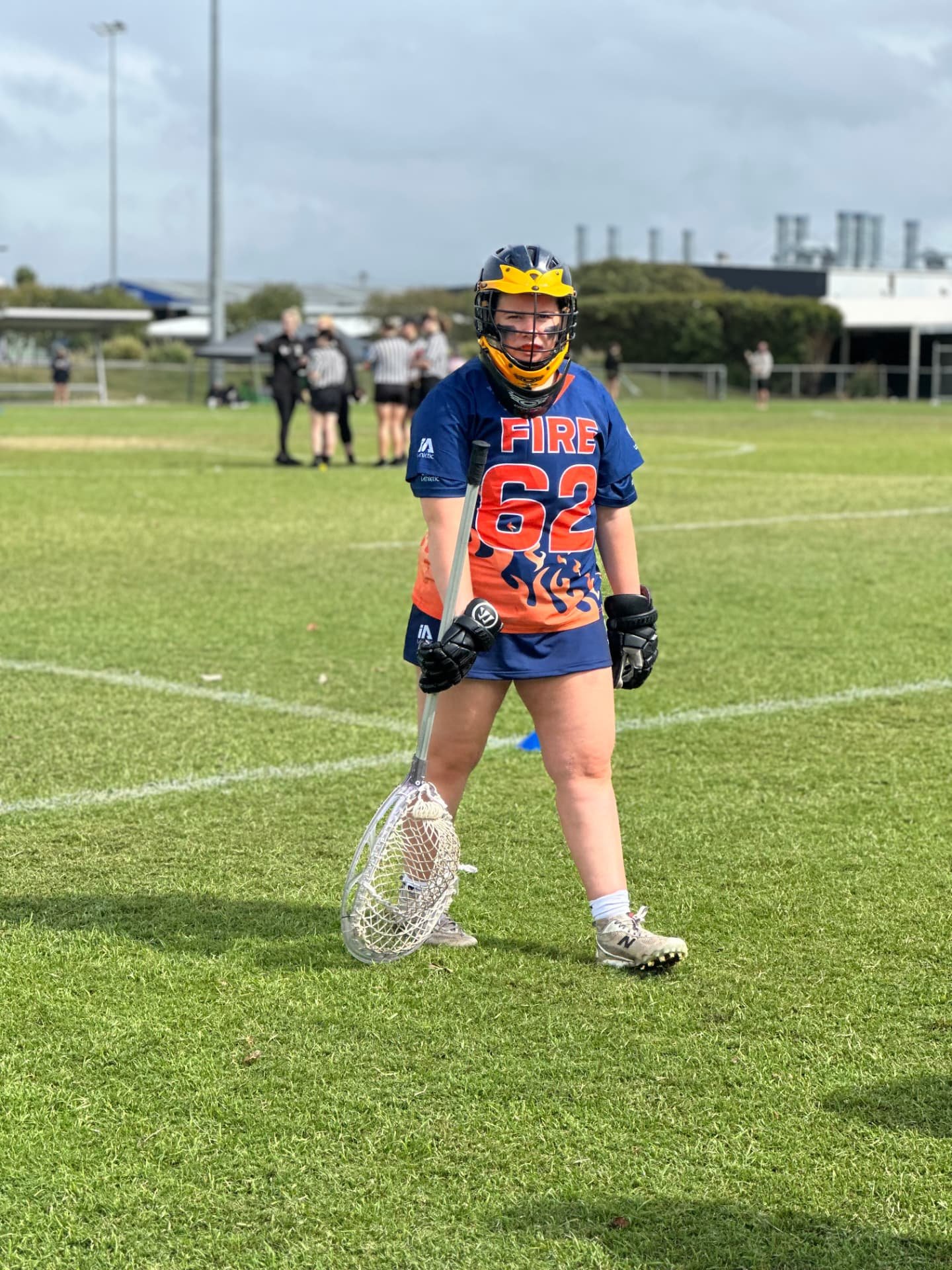 Ivy standing on the field in her FIRE #62 goalie gear.