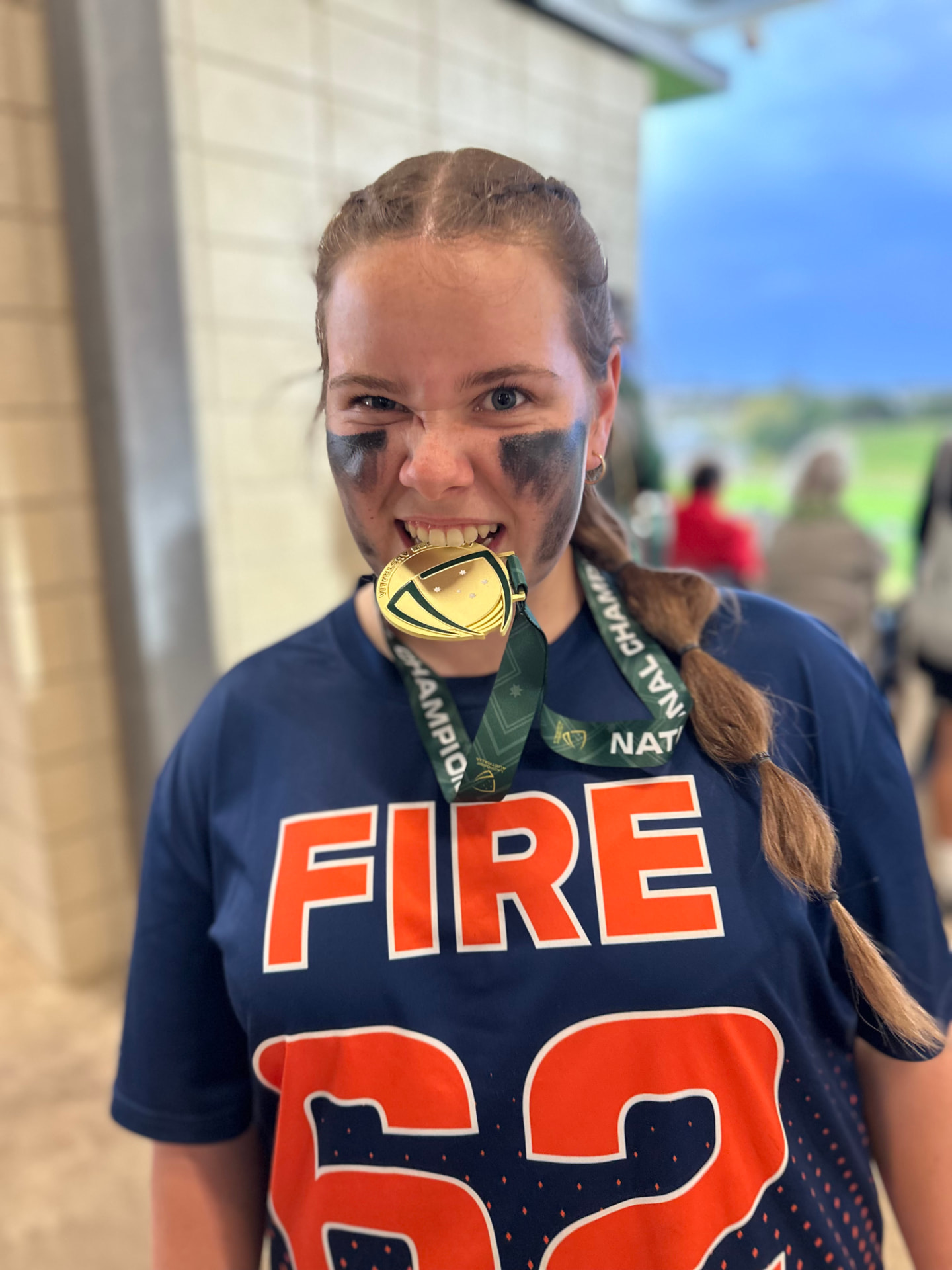 Ivy Merritt wearing her Victoria FIRE number 62 jersey and national championship medal after the 2026 U15 National Tournament on the Sunshine Coast.